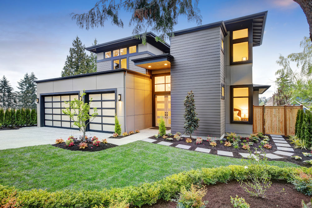 Brand new luxury home. The modern style house boasts a beautiful front yard. 
