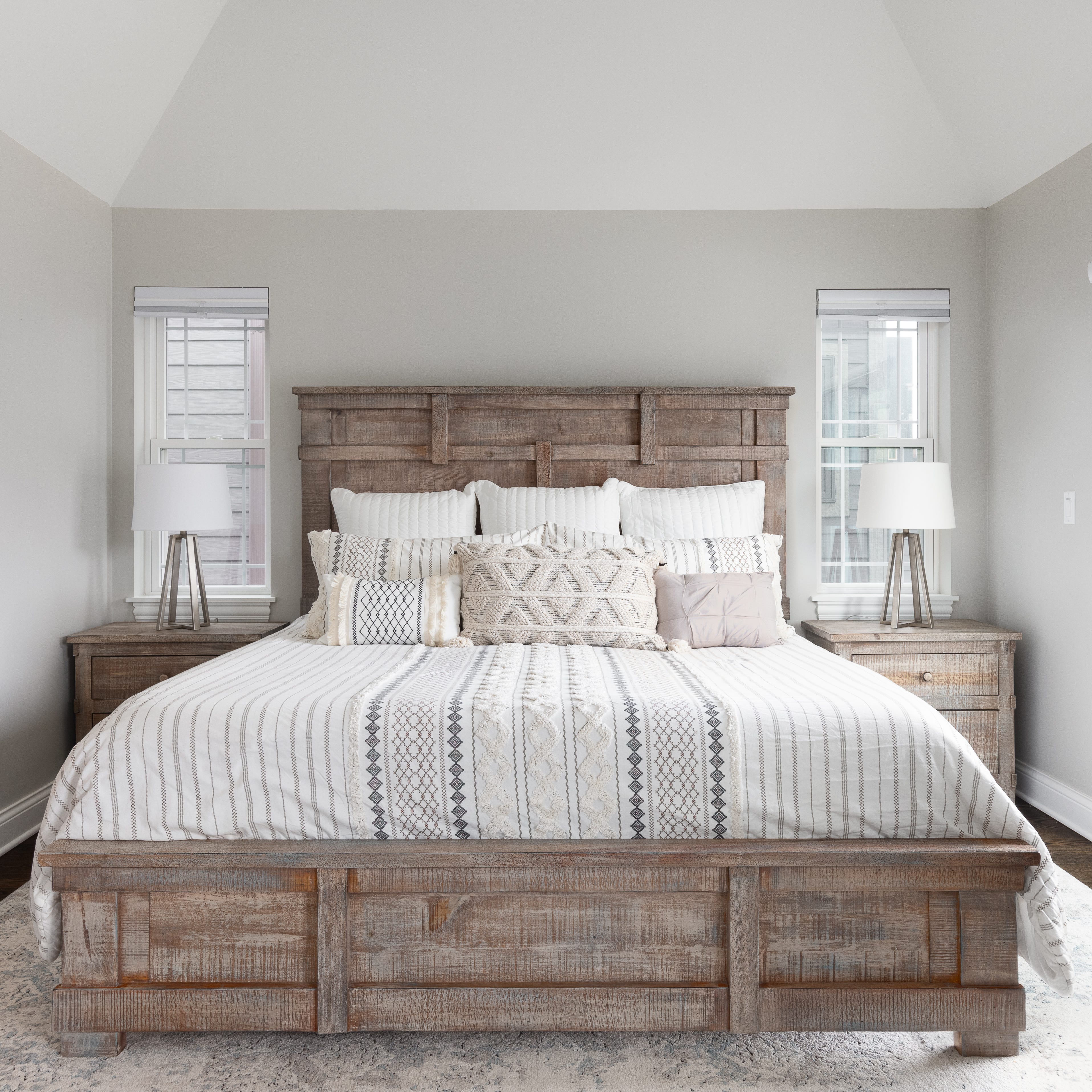 bedroom with wood headboard and footboard.