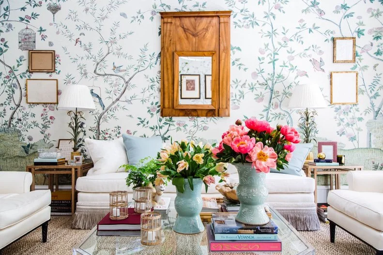 Asian style floral wall covering works well in this feminine living room from Beth Webb Interiors. Fresh flowers and complementary Asian vases add to the effect.