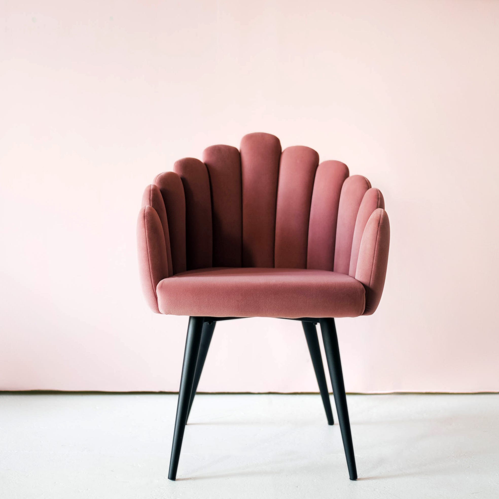 pink velor armchair with pink upholstery.