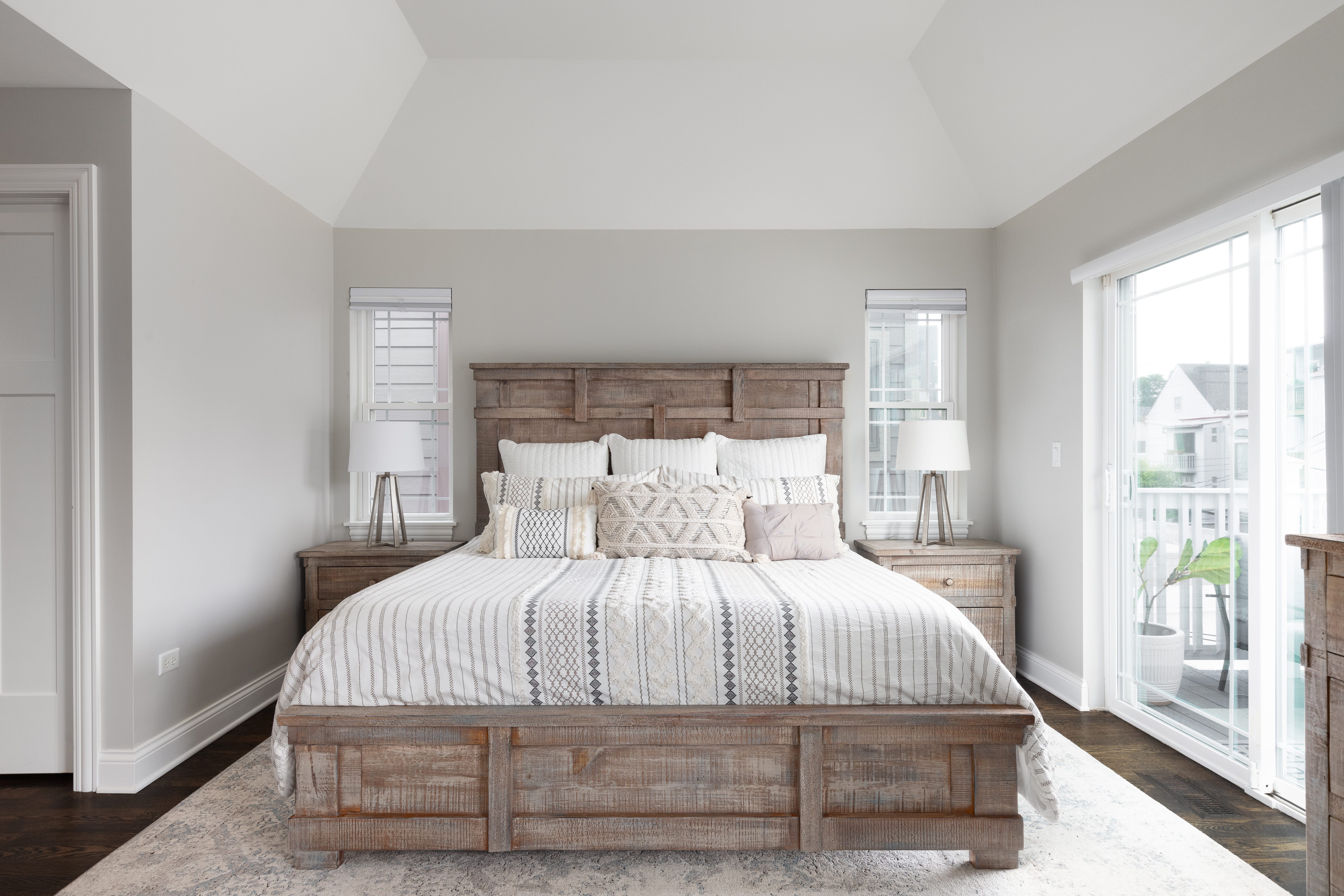 bedroom with wood headboard and footboard.