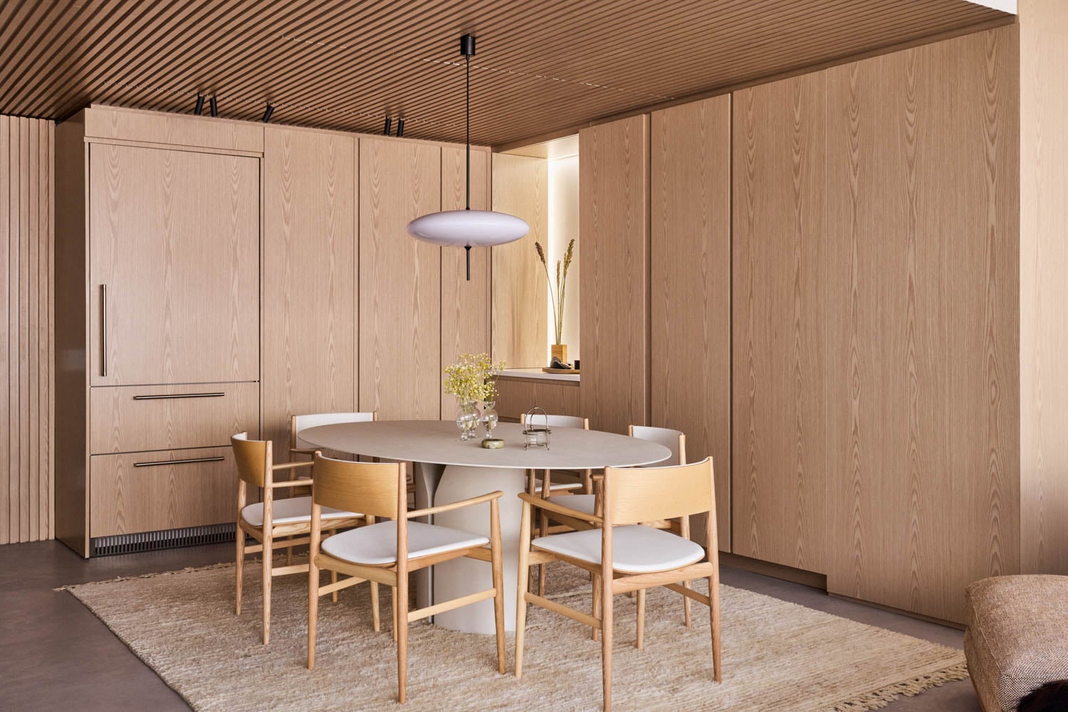 dining area with wooden chairs and cupboards