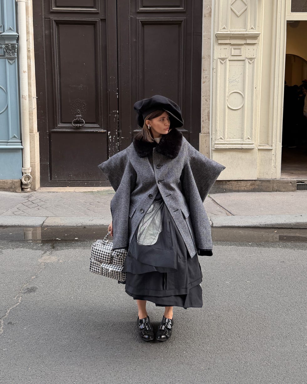 An individual who wears fashionable clothes with unique outerwear and accessories.