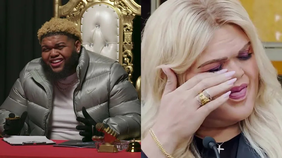 The clown Druski in a silver jacket sits on a golden throne, smiling. Druski in whiteface, with gray hair, wiping tears, wearing rings and makeup.