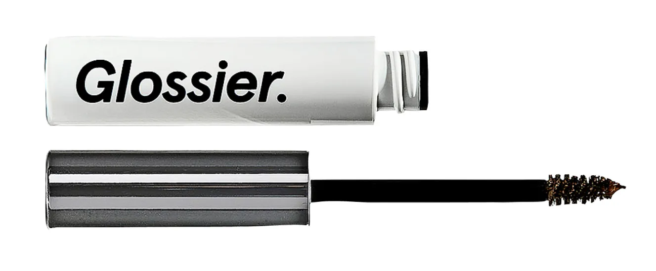 An open tube of Glossier Boy Brow Extension with its wand and brush.