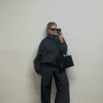 Producer Alexis Foreman in a funnel neck jacket.