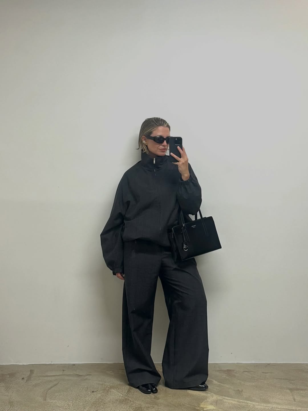 Producer Alexis Foreman in a funnel neck jacket.