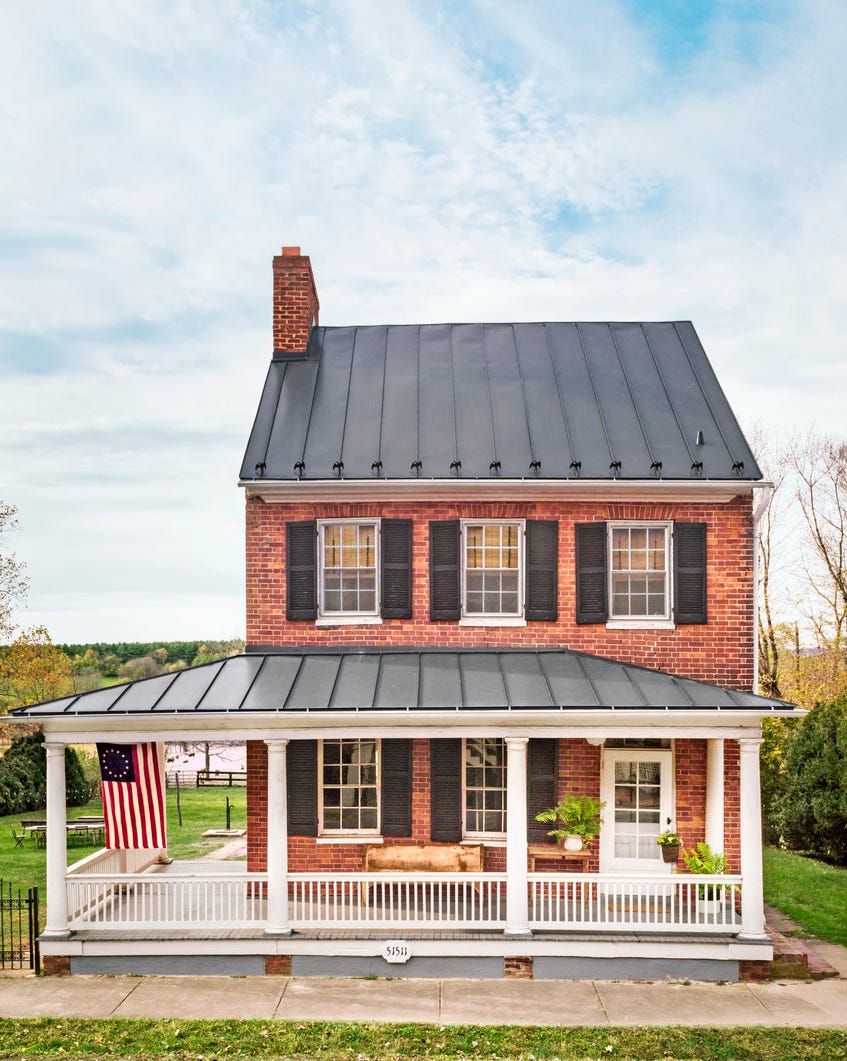 red brick federal house with front porch