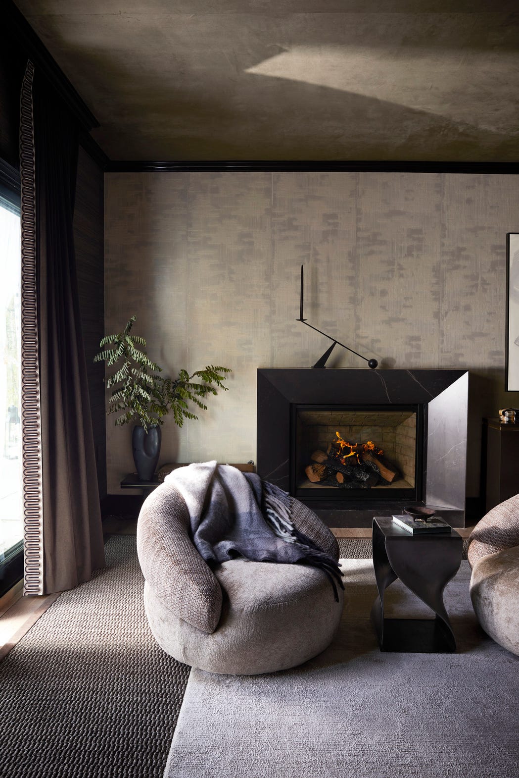 living room: rajni alex design @rajnialexdesign. high-end living room, writing units, entertainment, multi-purpose room, games room. fireside two additional barrel back swivels from bernhardt in stroheim (seat) and s. Harris (behind) rugs provide plenty of seating to take in the view or the fireplace. carpets: jd staron (top), fibreworks (bottom). round fireplace: dekton and architectural grille. whole home 2024. This year's energy efficient home is located in the conservation minded community of sprout\, located on a private preserve in Hendersonville\, North Carolina.