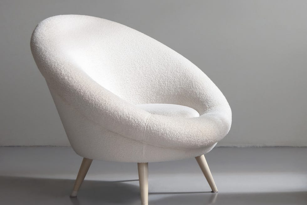 Fashion bag for women on the catwalk and a white chair in the house concept of shops selling clothes and accessories