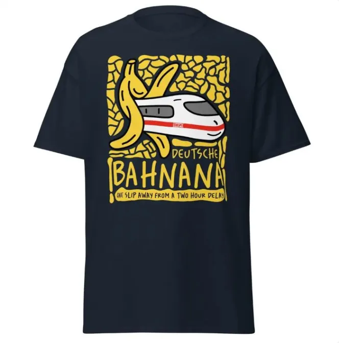 A picture of a white train with a red stripe and a banana peel around it, with text "Deutsche Bahnanana, another slip away with a two-hour delay" in a dark blue t-shirt.