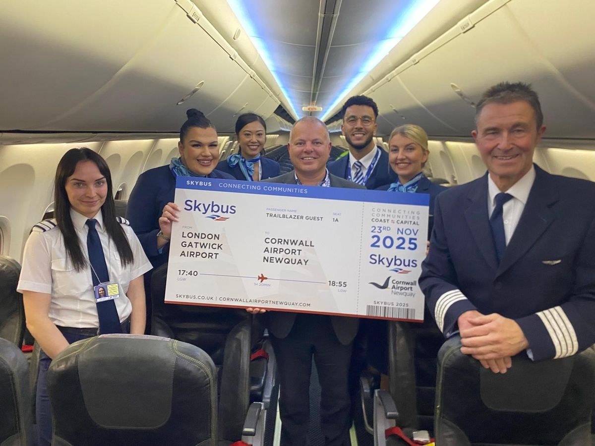 Jonathan Hinkles, managing director of Skybus, pictured with other staff celebrating the first flight from Newquay to London.