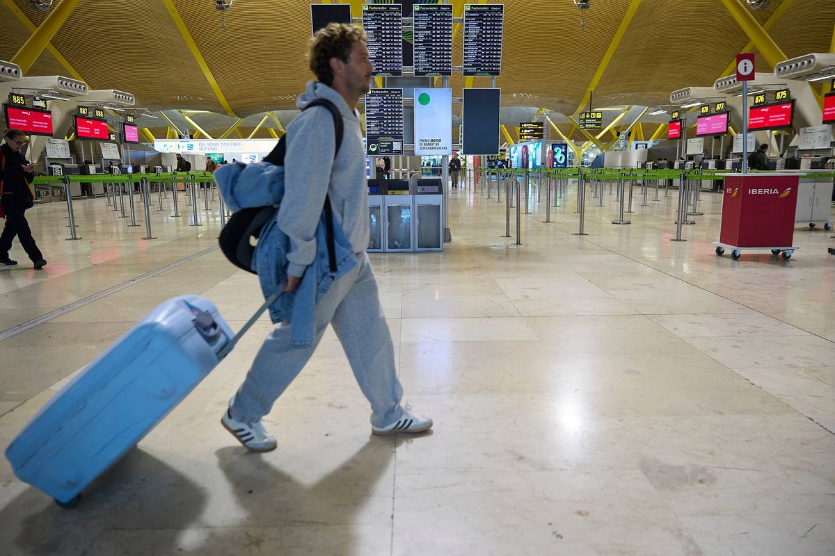 A passenger in Terminal T4 at Adolfo Suarez Madrid-Barajas airport as the strikes hit