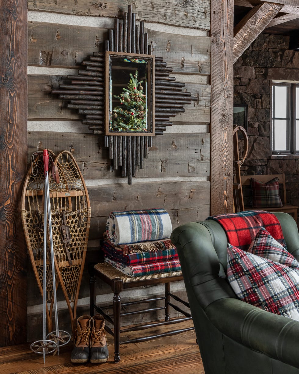 a rustic cabin with plaid blankets and snowflakes
