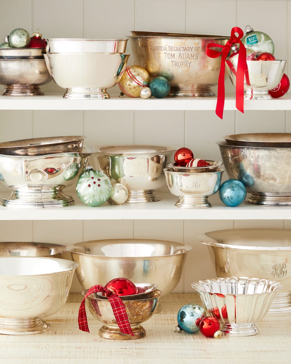 antique silver bowls on shelves