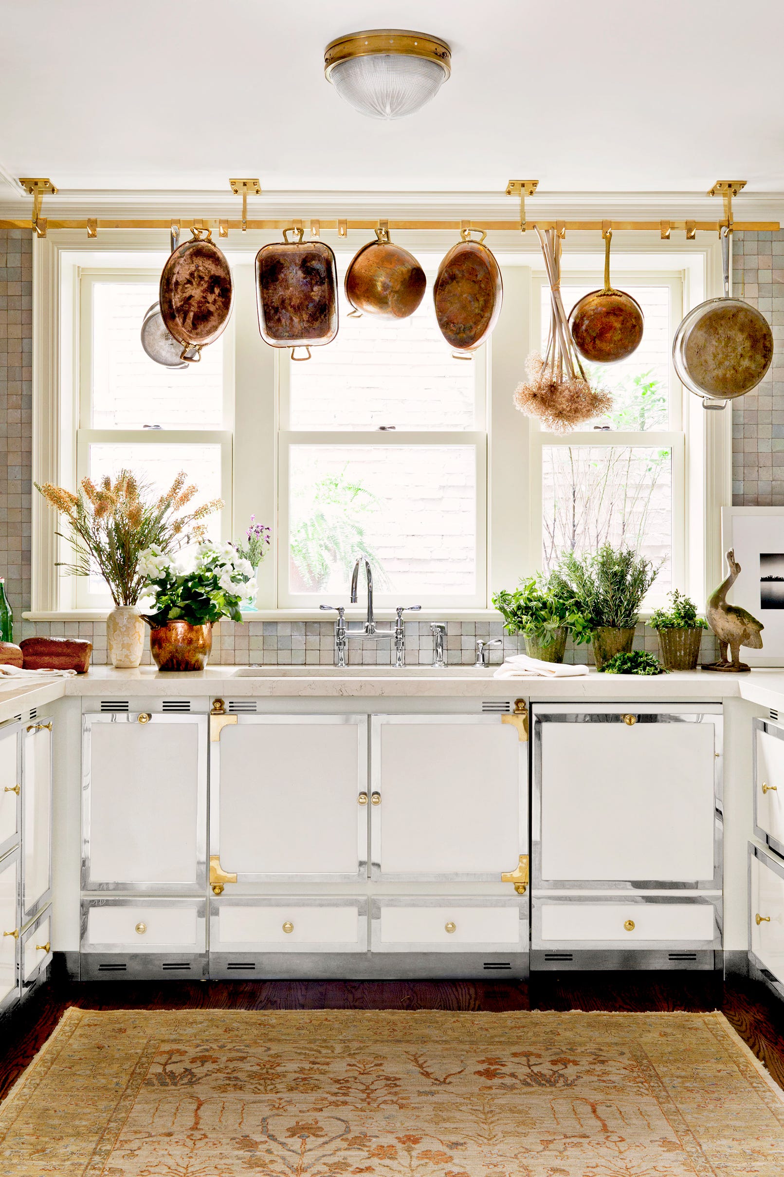 Small white kitchen with hanging pots Small white kitchen with hanging pots