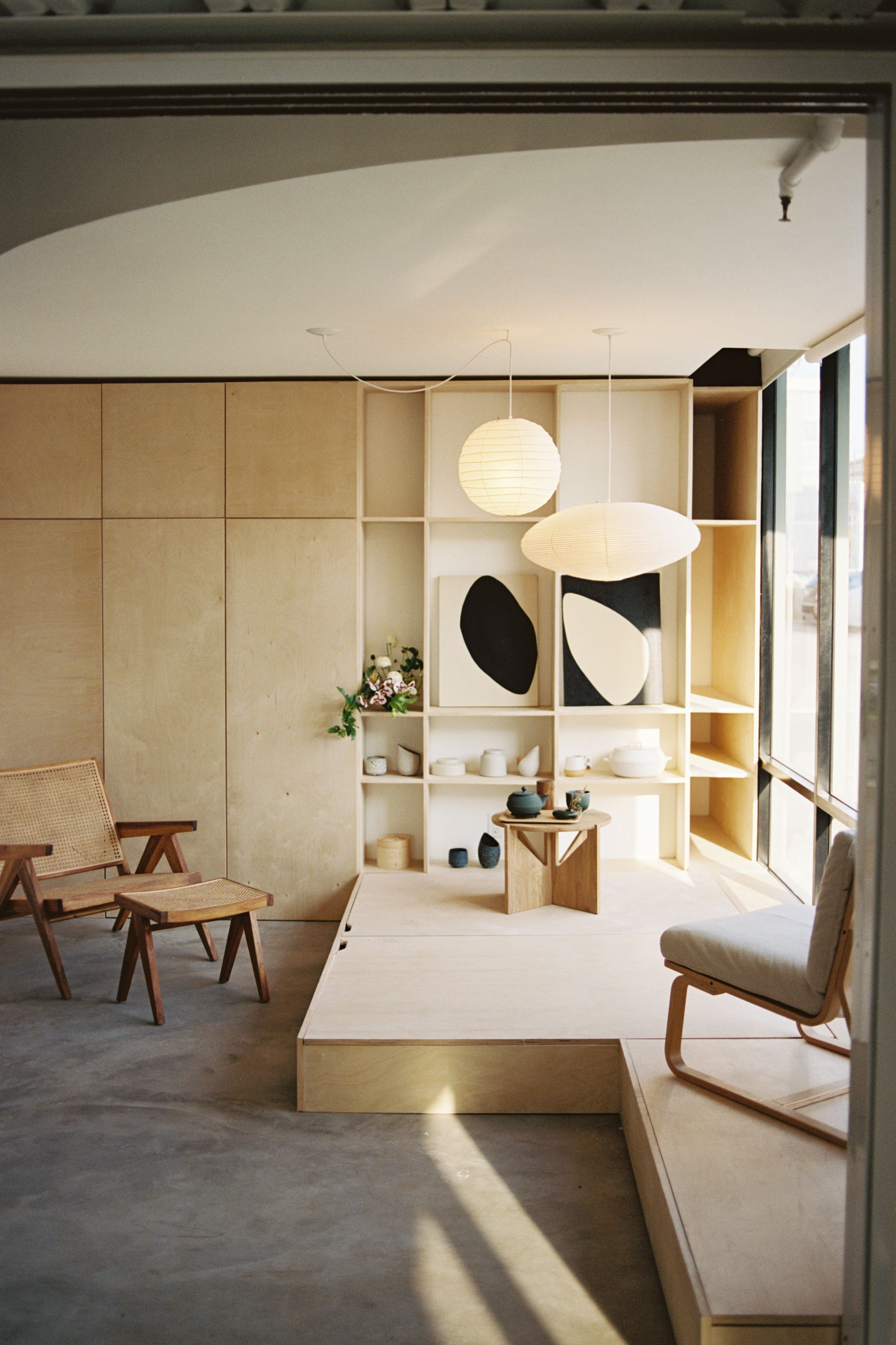 a room with a mirror and chairs a room with a mirror and chairs