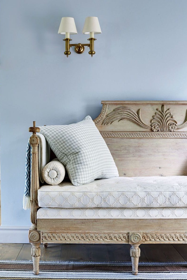 vintage sofa with decorative elements and soft lamps